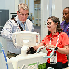 Two people looking at equipment
